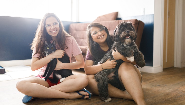 Portraits of women and pets