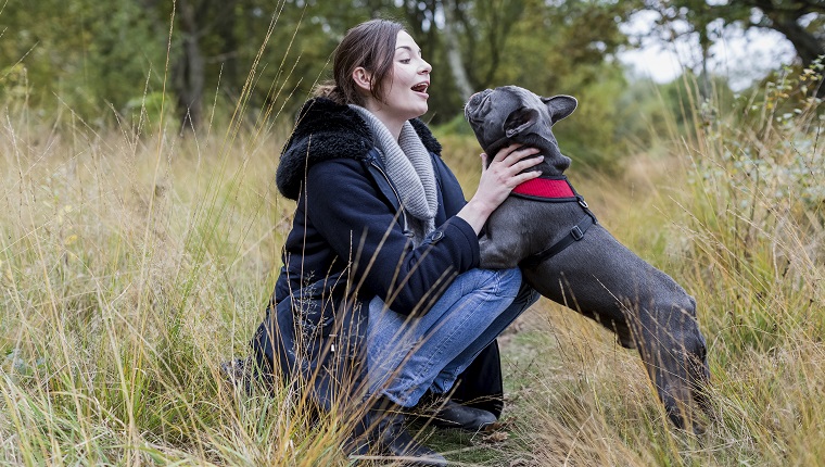 Woman with her dog in nature