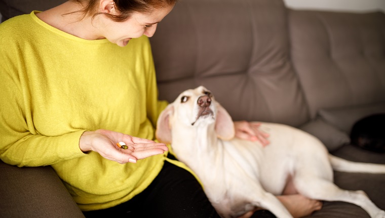 Woman taking supplements.