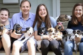 Truskowski family holding puppies with Nellie