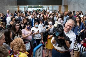 WASHINGTON, DC - OCTOBER 27: Sen. Thom Tillis (R-NC) holds up his dog Mitch, dressed as Mitch McConnell, during his annual Halloween dog parade in the Hart Senate Office Building on Capitol Hill October 27, 2021 in Washington, DC. Tillis organized the first Halloween dog party in 2017.