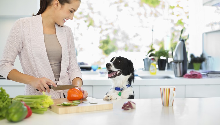 Woman chopping vegetables in kitchen