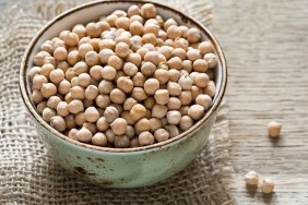 Chickpeas in a bowl, closeup view. Healthy vegetarian product for cooking, indian cuisine, vegan cuisine