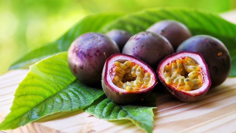 Passion fruits on wooden table