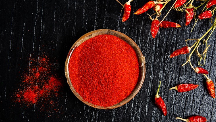 Grounded red paprika spice in a bowl