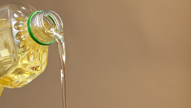 Oil Being Poured in a Nonstick Pan for Cooking