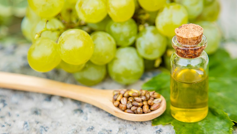 grape seed oil in a small jar. Selective focus.nature