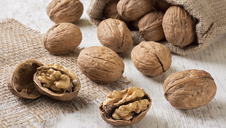 Close-up of Walnuts on White Wooden Table