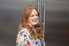 Pioneer Woman Ree Drummond, standing in kitchen, welcomes new dog into family.