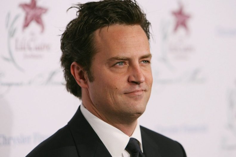 close-up of actor Matthew Perry in suit