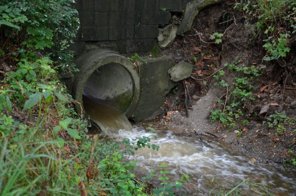 Water flowing through a storm drain, like the one where firefighters in Pennsylvania recently rescued a dog stuck in a storm drain