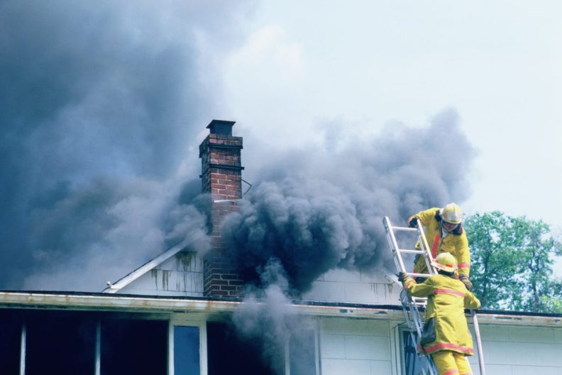 Firefighters responding to a house fire like the UK incident in which firefighters rescued a dog.