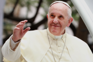 Pope Francis waves to thousands of followers as he arrives at the Manila Cathedral on January 16, 2015 in Manila, Philippines.