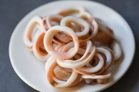 A closeup photo of plain, cooked calamari which dogs can eat safely.